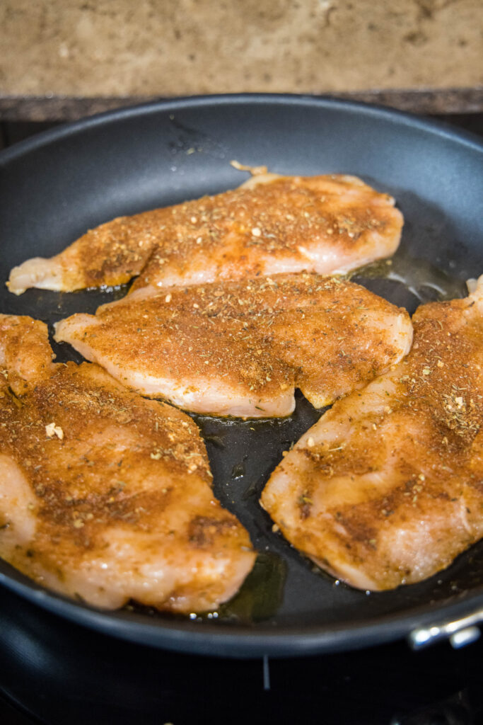 cooking chicken in a skillet