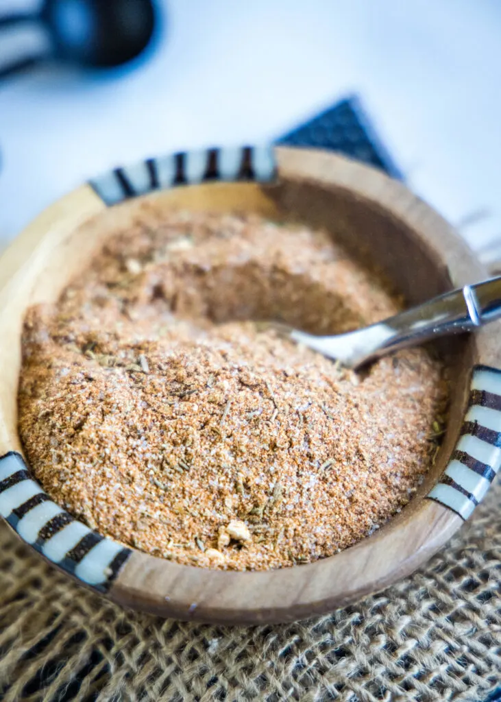 cajun seasoning in a small bowl with a spoon
