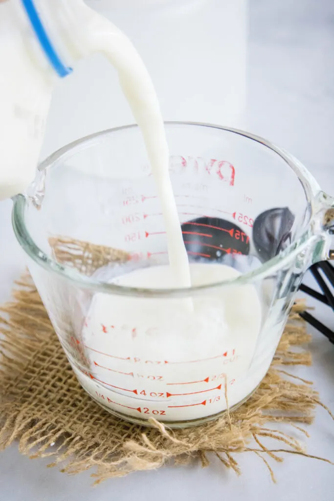 Milk being poured into a pyrex
