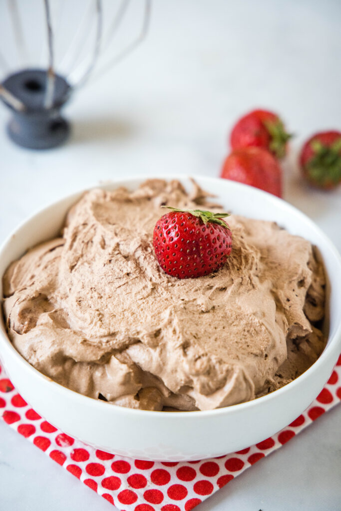 bowl of chocolate whipped cream with strawberries