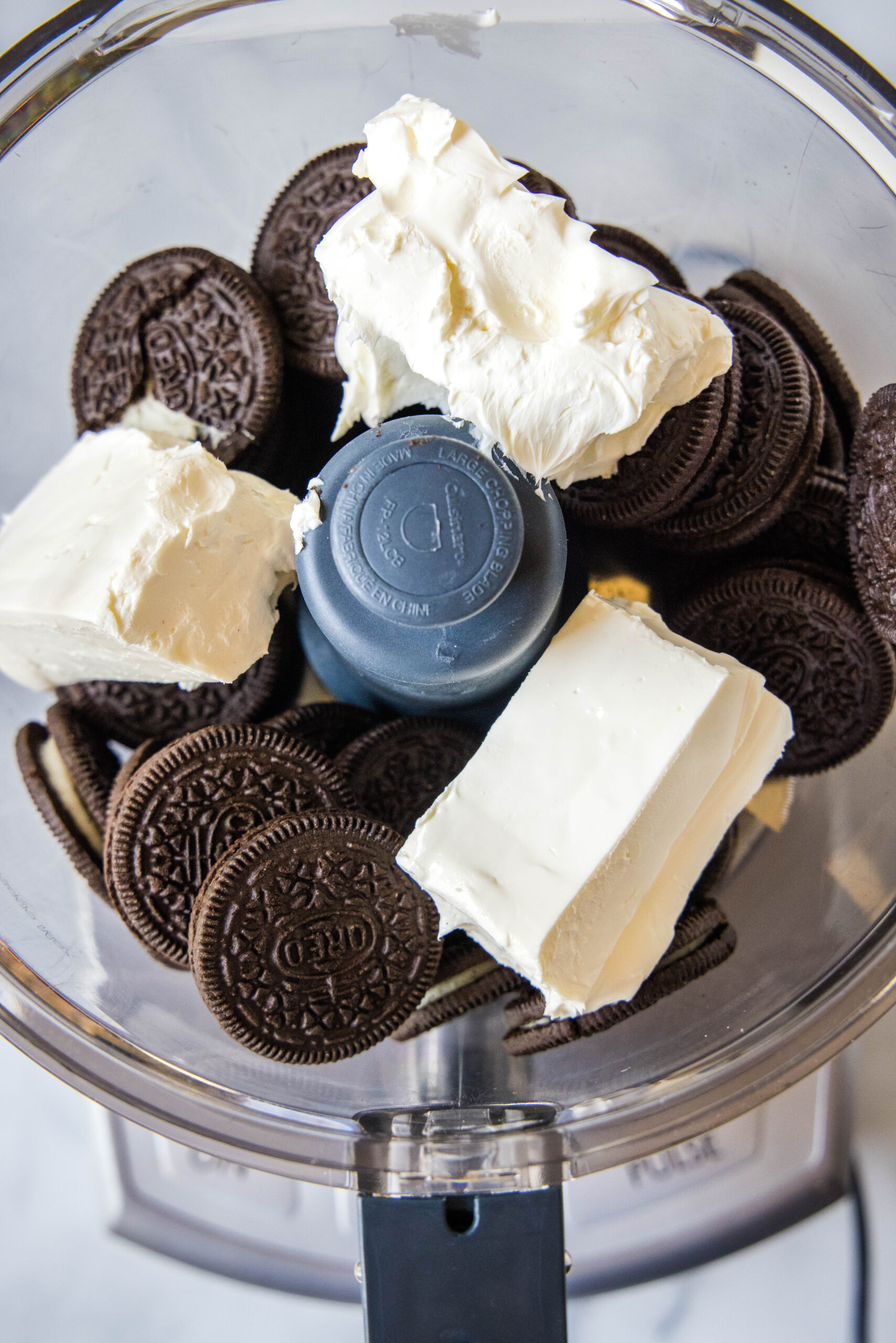 oreos and cream cheese in a food processor