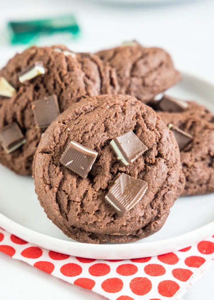 chocolate pudding cookies with andes mints on a plate