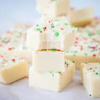 stacked sugar cookie fudge with a bite taken out