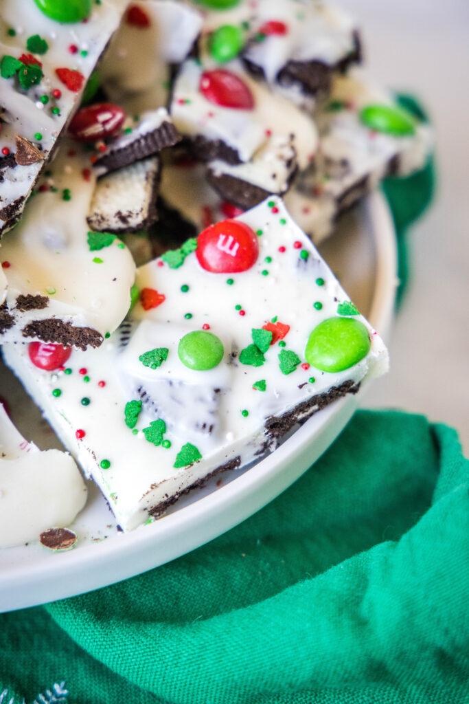 slices of white chocolate christmas bark on a plate