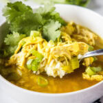 cropped close up ginger chicken soup in a whie bowl