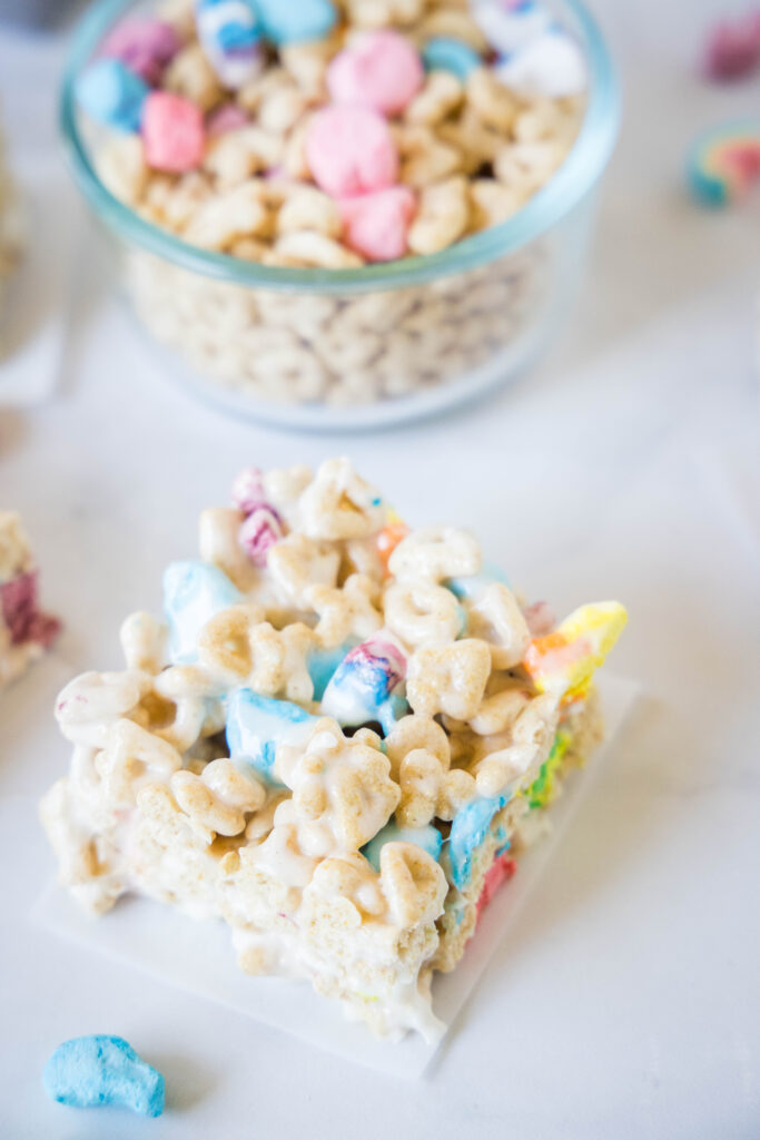 lucky charms krispie treats cut into pieces on counter