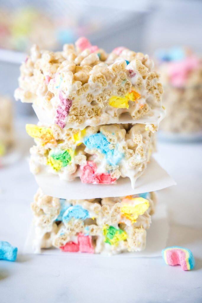 stacked lucky charms krispie treats on a counter