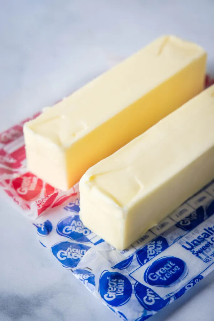 sticks of butter sitting on the wrapper