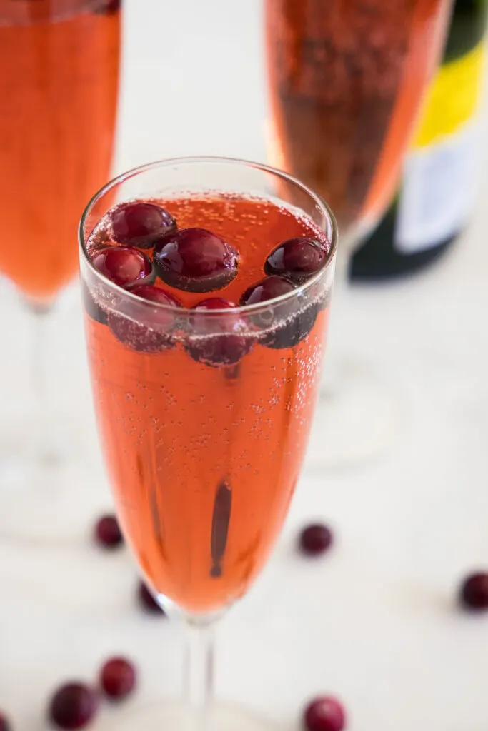 cranberry mimosa in a champagne glass