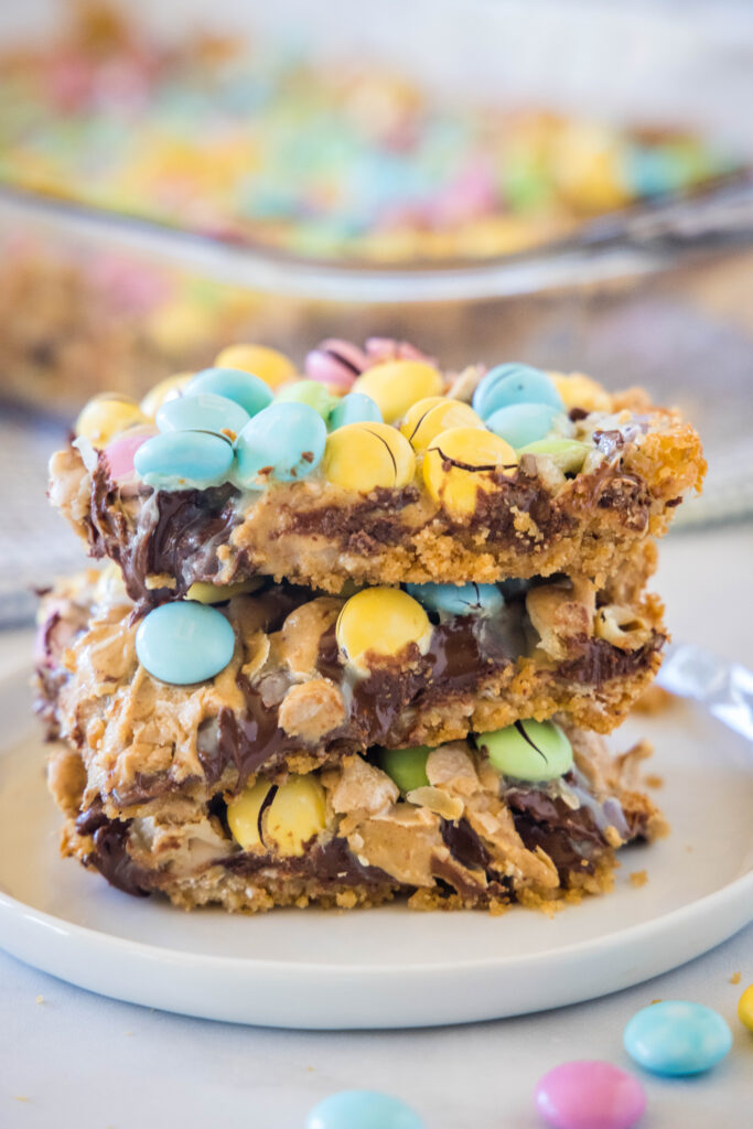 a stack of easter magic bars on a white plate
