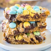 cropped close up of easter magic bars stacked on a white plate