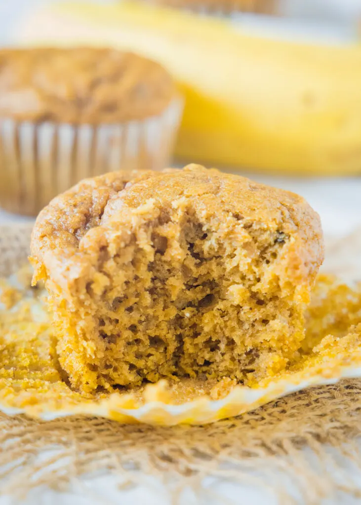 pumpkin banana muffin with a bite taken out of it