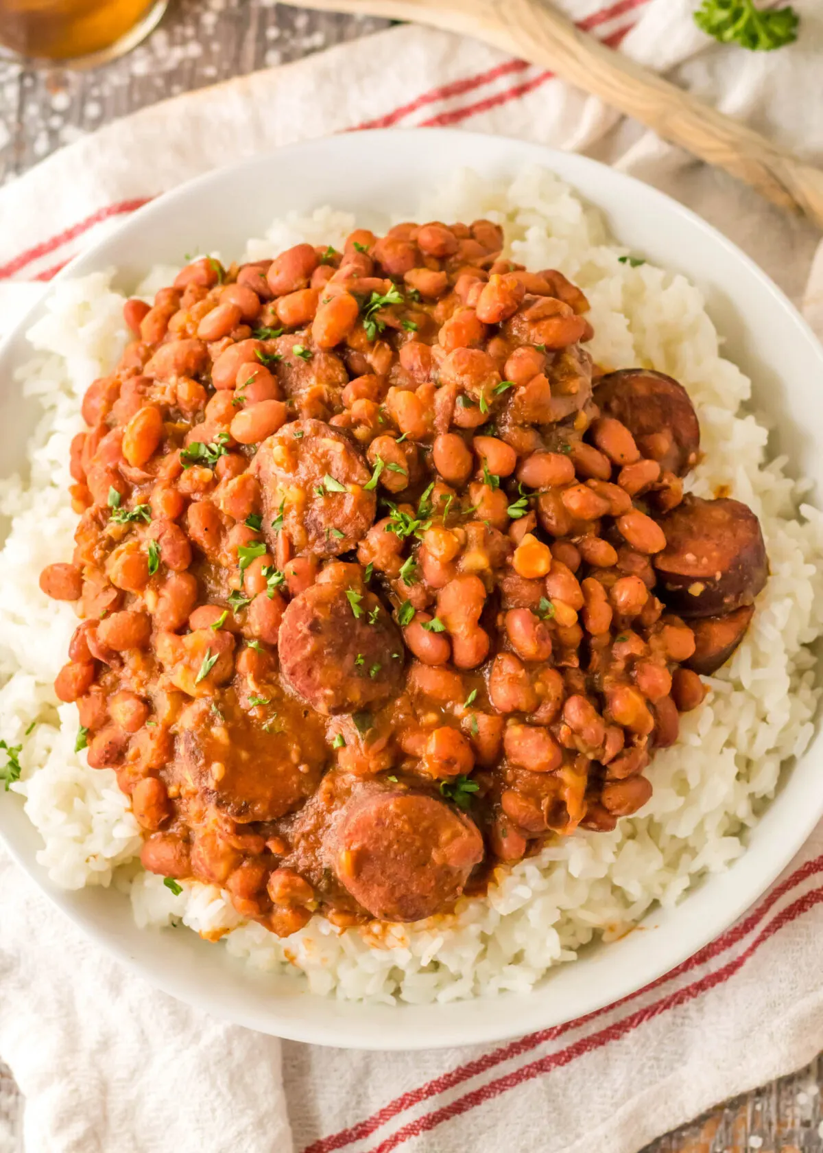 Overhead view of a plate of red beans, sausage, and rice.