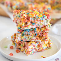 cropped close up fruity pebbles bars on a white plate