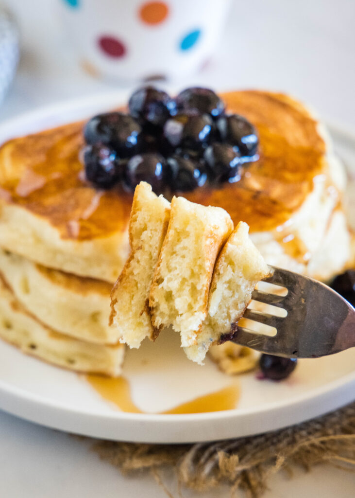 a bite of pancakes on a fork