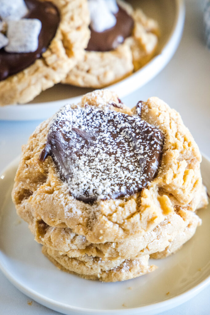 muddy buddy cookies dusted with powdered sugar