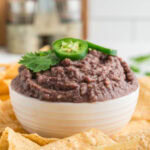 cropped close up black bean dip in a bowl