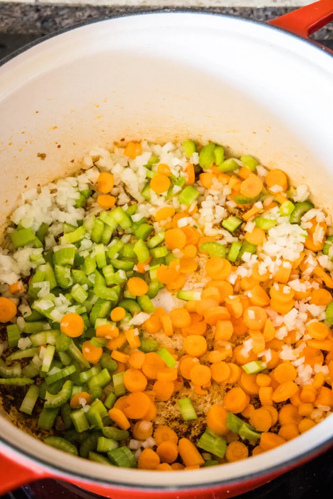 Diced vegetables in a large pot.