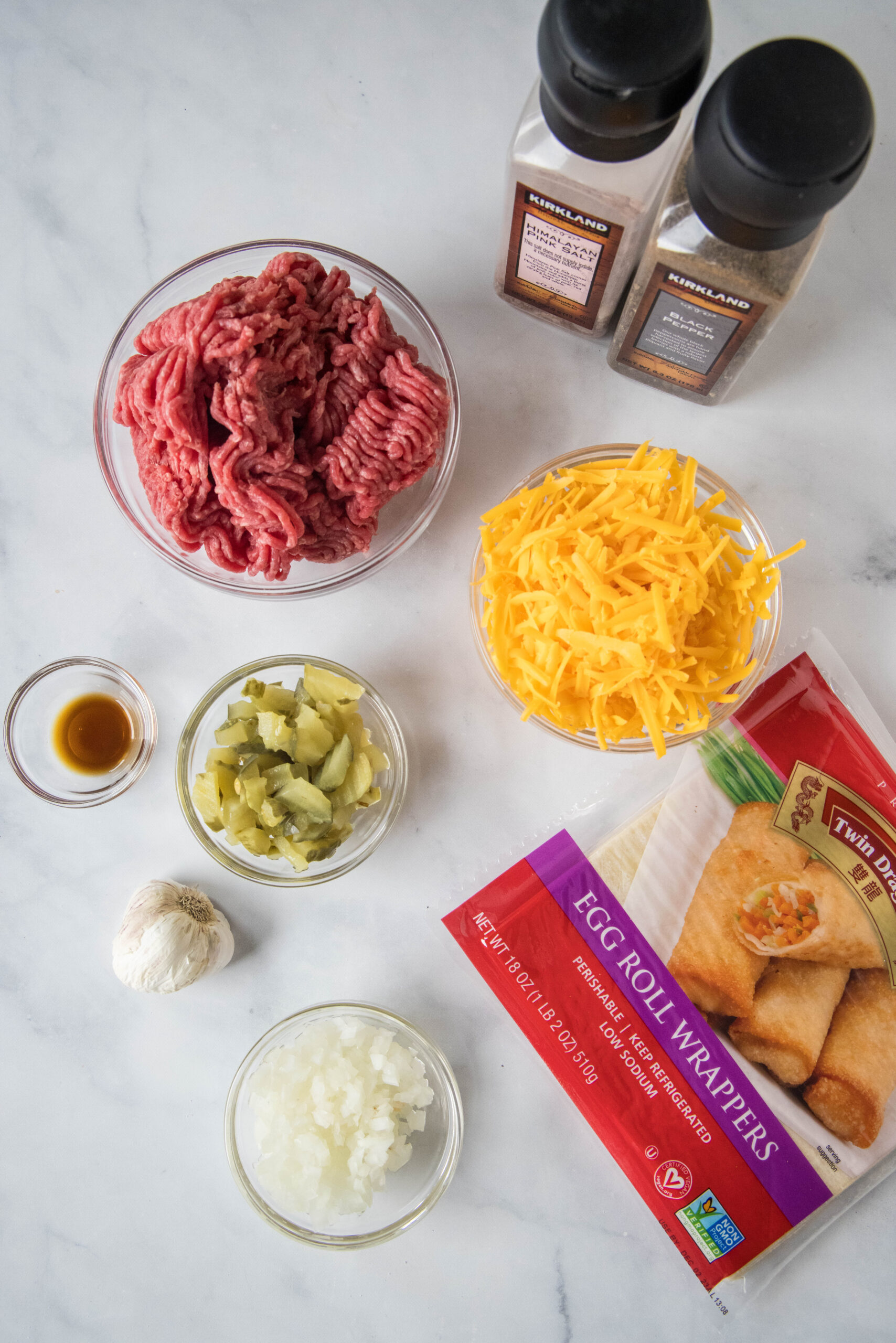 Ingredients for cheeseburger egg rolls.