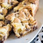cropped close up chocolate chip cookie cheesecake bars