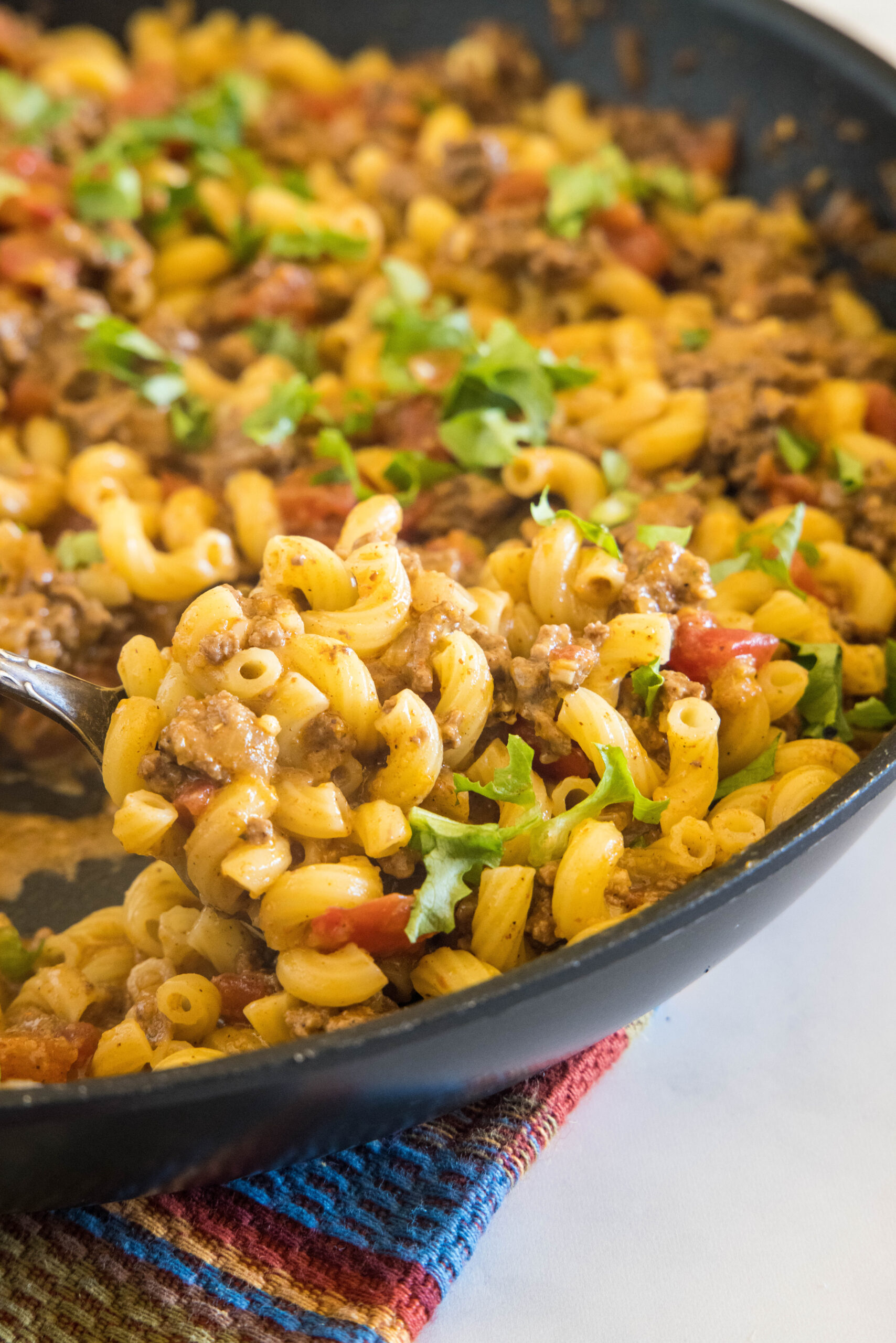 Taco mac and cheese in a large skillet.