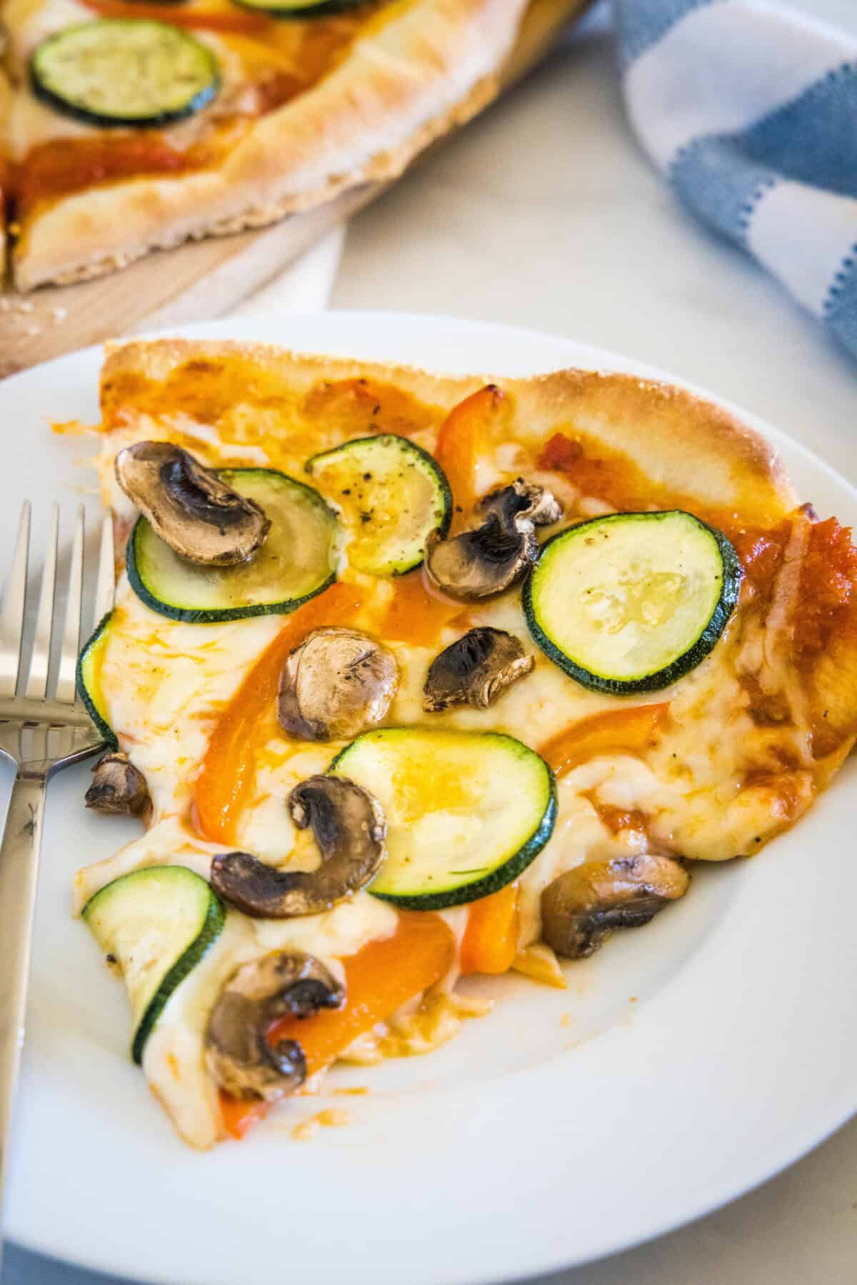 sliced of vegetable pizza on a plate