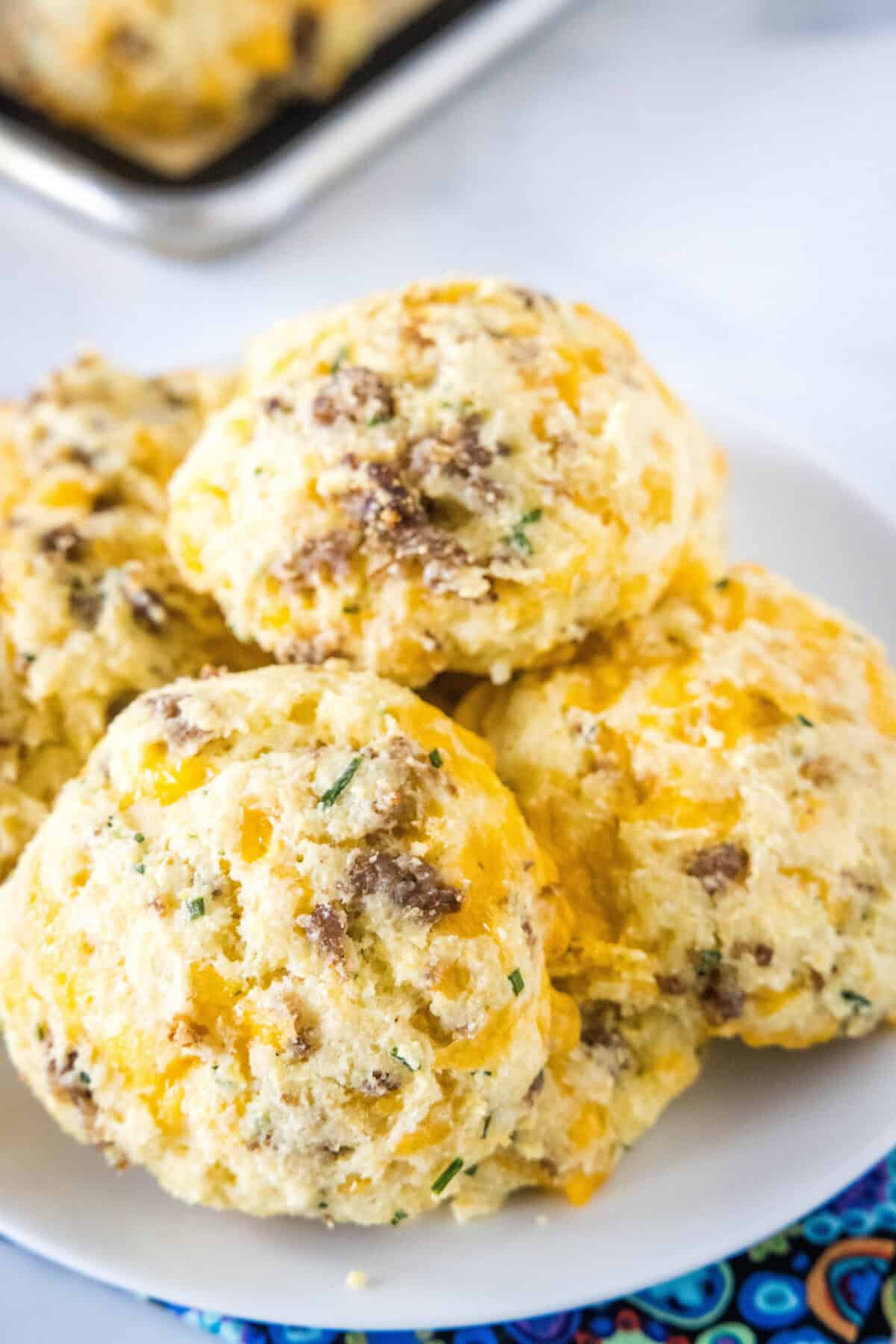 looking down on a plate of cheese and sausage biscuits