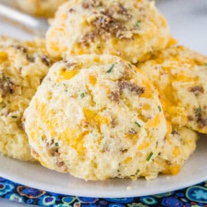 close up cheese & sausage biscuits on a plate