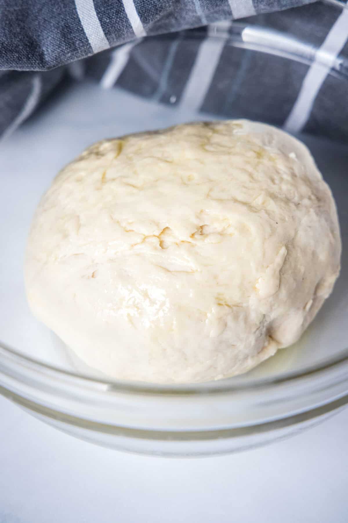 Amish country bread dough in a glass bowl.