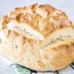 Baked Amish bread on top of a dishcloth.
