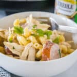 Crockpot Cajun chicken pasta in a bowl with a fork.