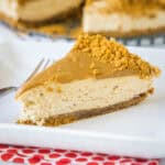 close up slice of no bake biscoff cheesecake on a plate
