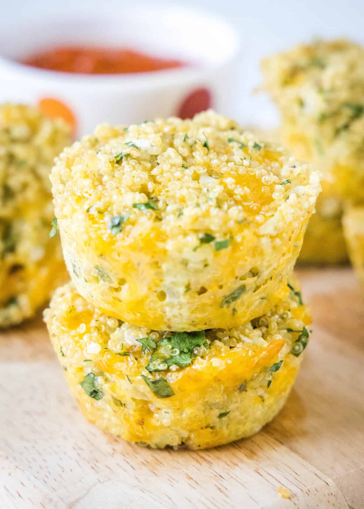 quinoa bites stacked on a cutting board