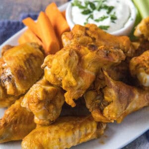 cropped close up chicken wings on a plate