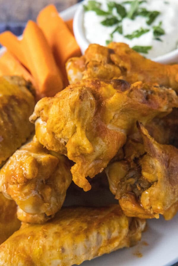 cropped close up chicken wings on a plate