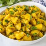 close up curried potatoes in a bowl