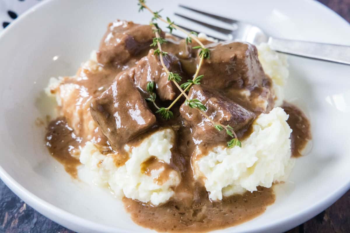 These No Peek Beef Tips are melt-in-your-mouth tender and packed with rich, savory flavor. Baked low and slow in a delicious gravy, they’re an easy, hands-off dinner the whole family will love!