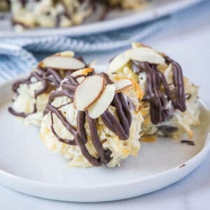 cropped close up almnod joy cookies on a white plate