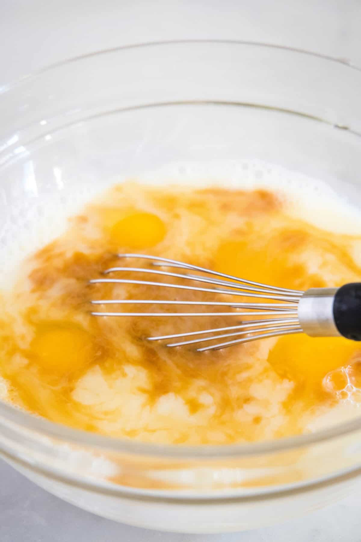 eggs, milk and vanilla in a mixing bowl