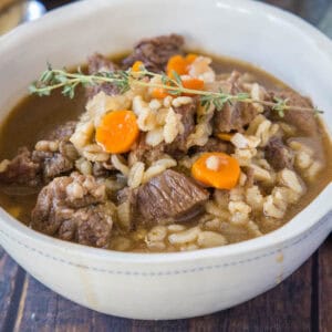 cropped close up beef barley soup in a bowl