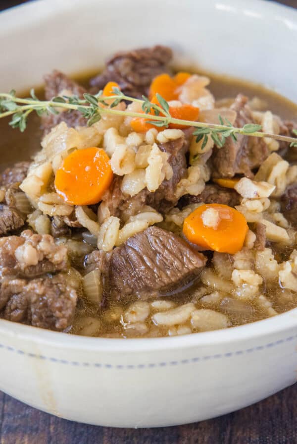 cropped close up beef barley soup in a bowl
