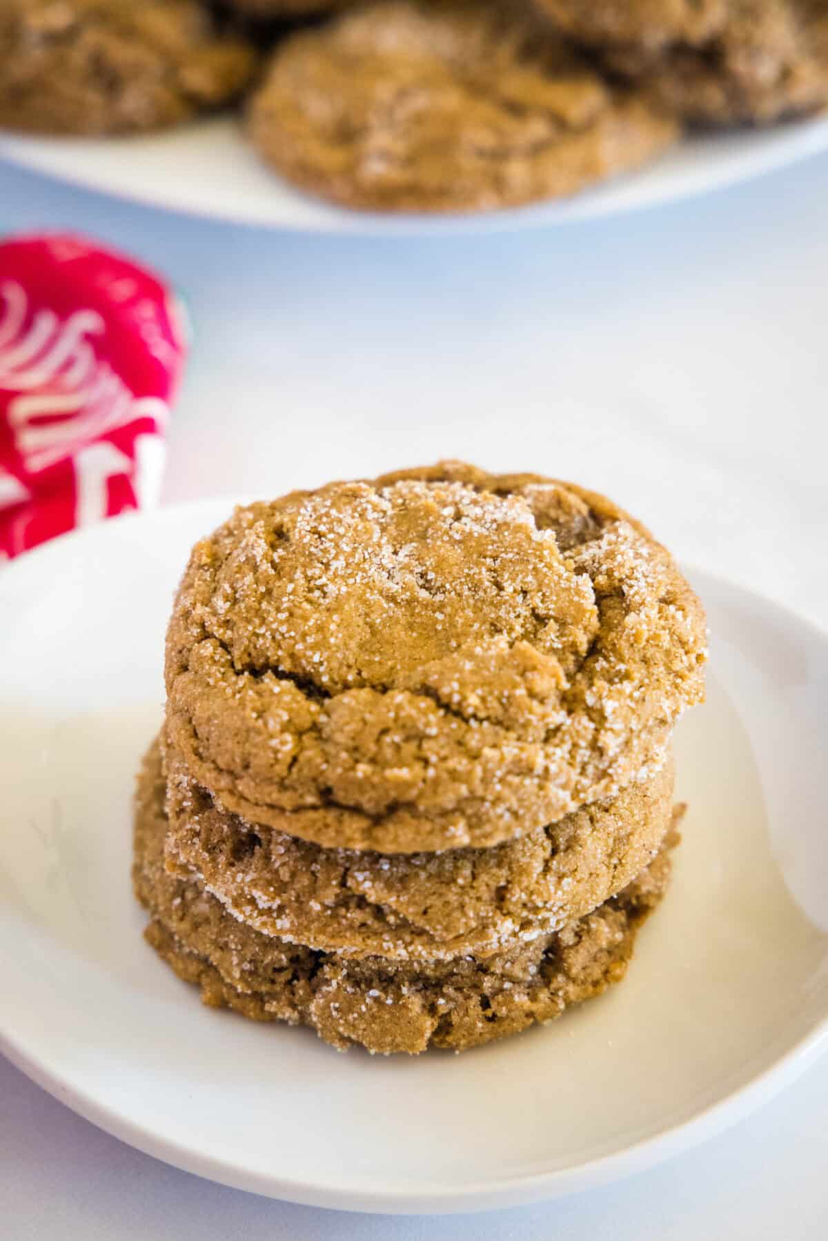 looking down on stack of molasses cookies on a white plate