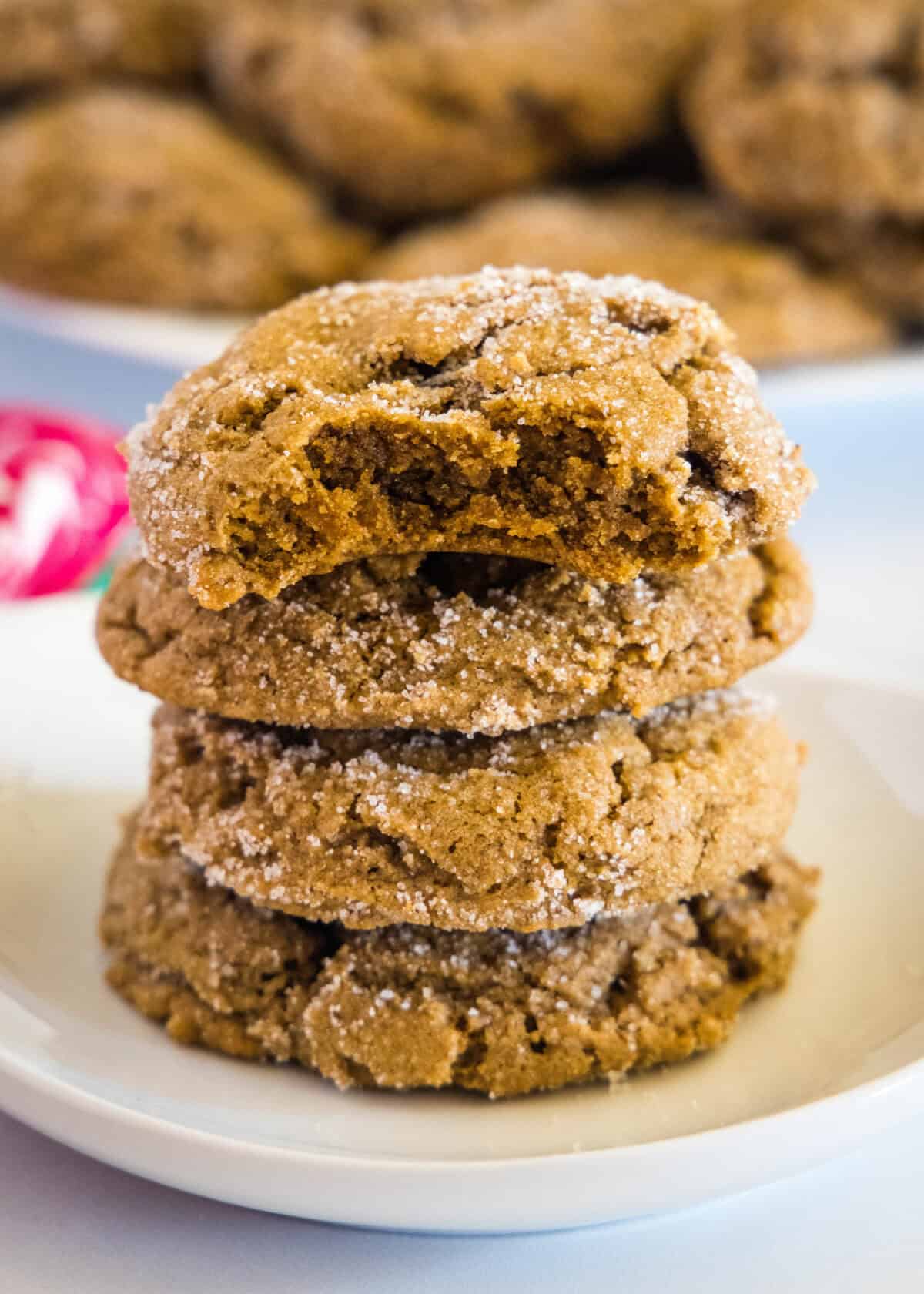 stacked molasses cookies on a plate