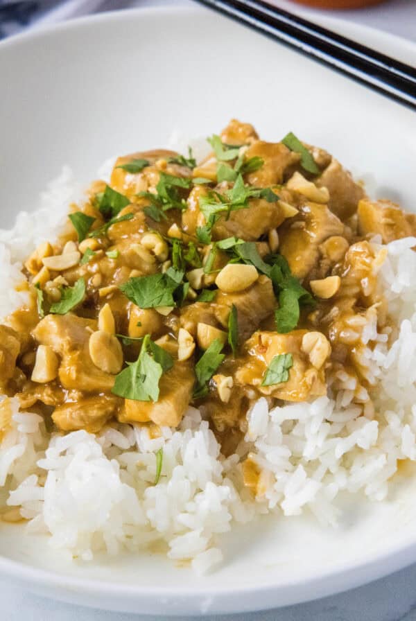 close up chicken satay stir fry over rice