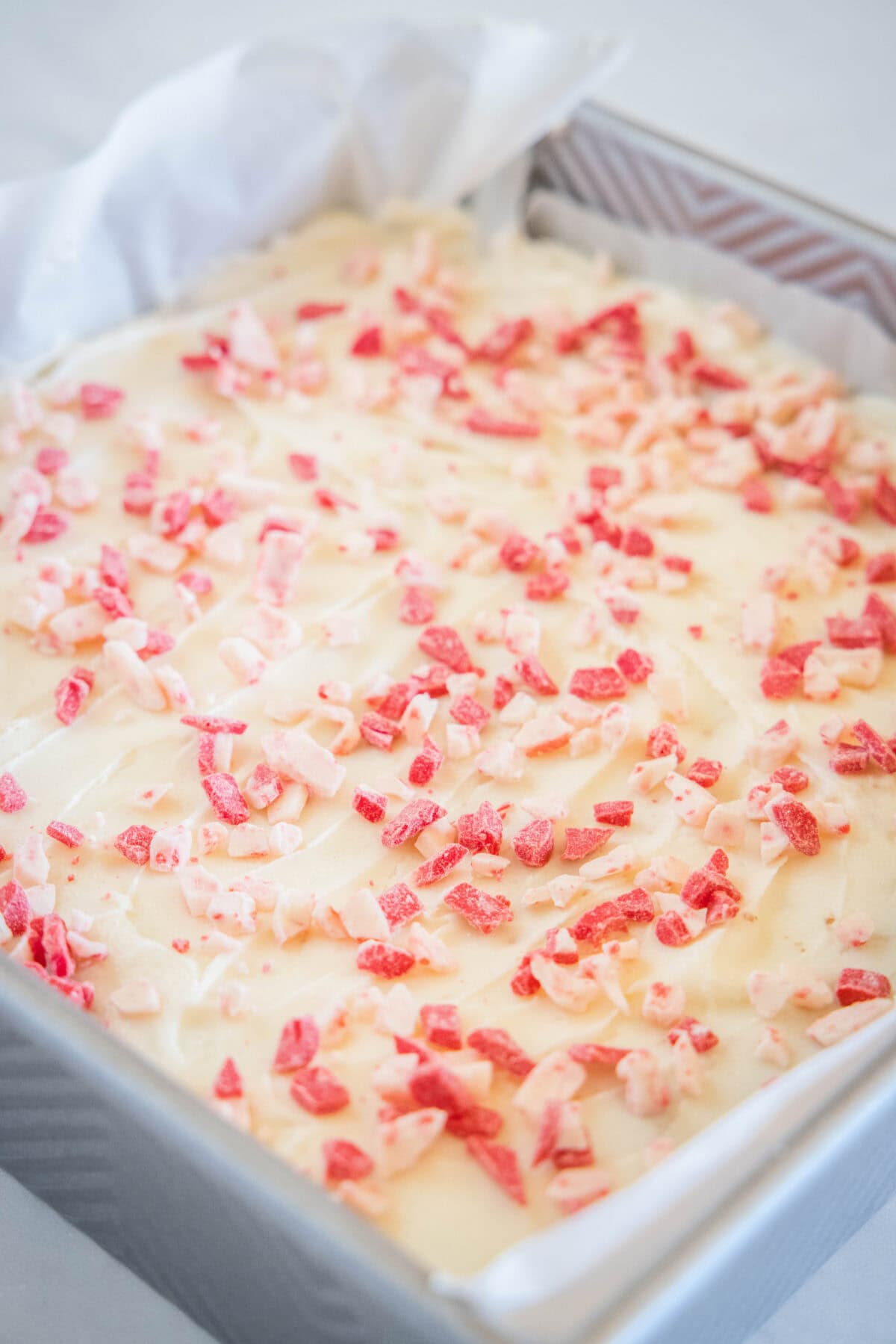 sprinkled peppermint candy over frosted brownies