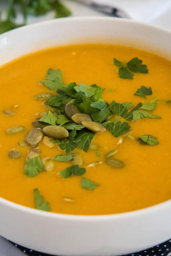 cropped close up butternut squash soup in a bowl