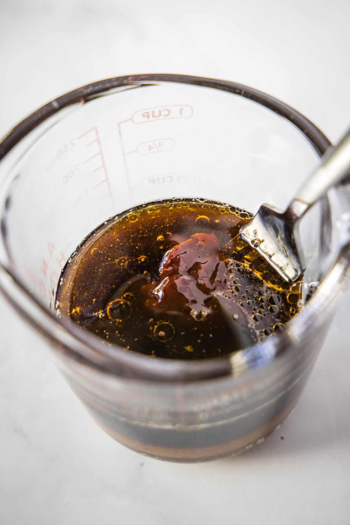 korean beef bowls sauce in a measuring cup