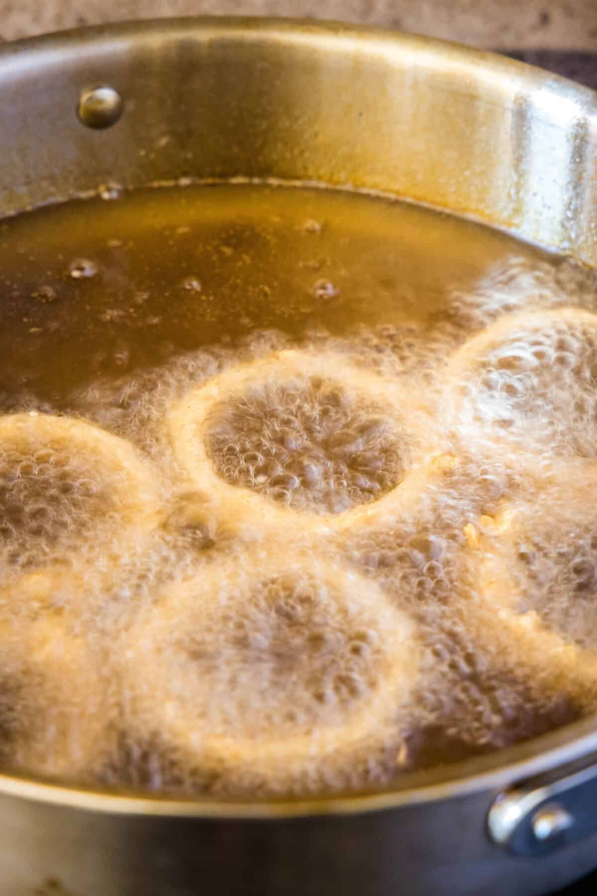 onion rings in oil frying