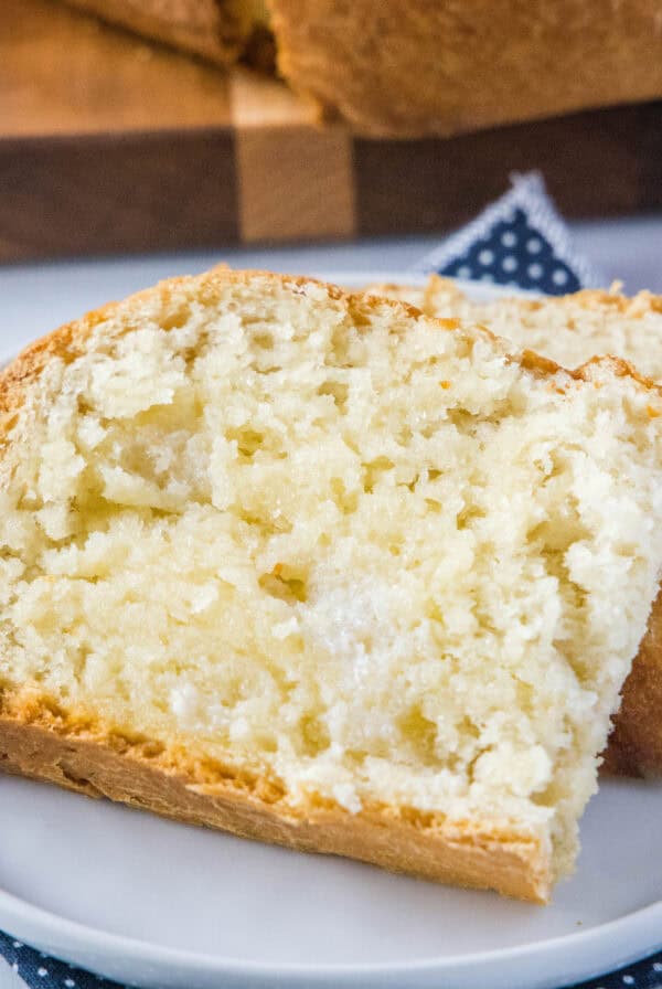 close up slice of bread with butter on a plate