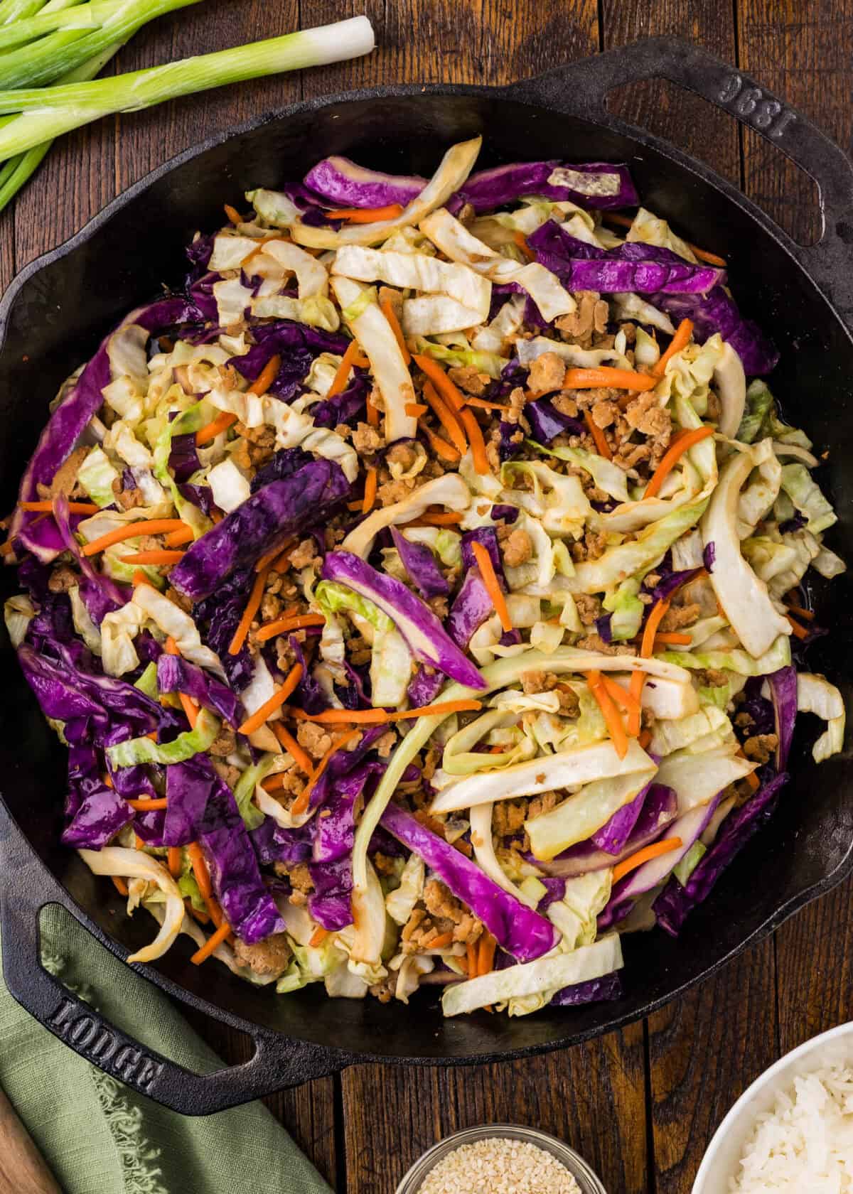cabbage in skillet cooking down with ground chicken